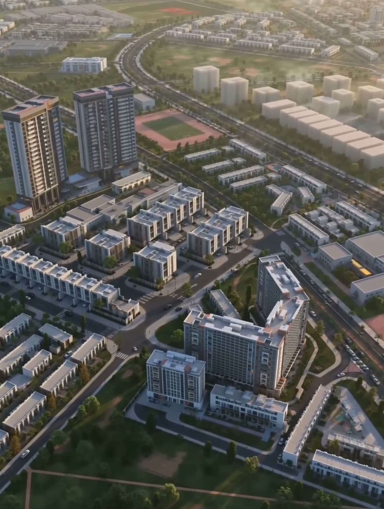 Aerial view of the Verdana community in Dubai Investments Park, rows of townhouses and apartment buildings with landscaped streets